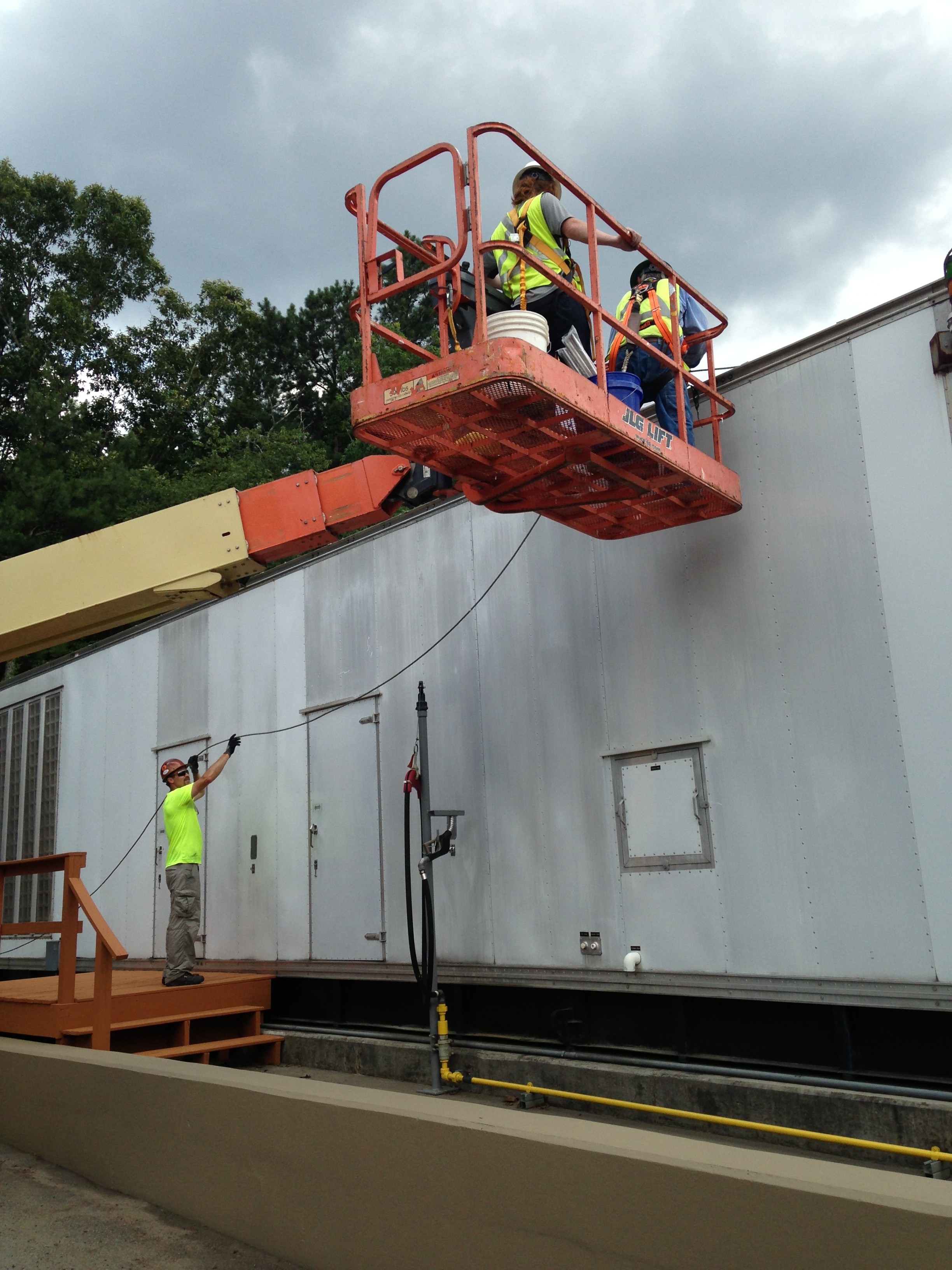 Lightning protection crew working from a lift at a data center